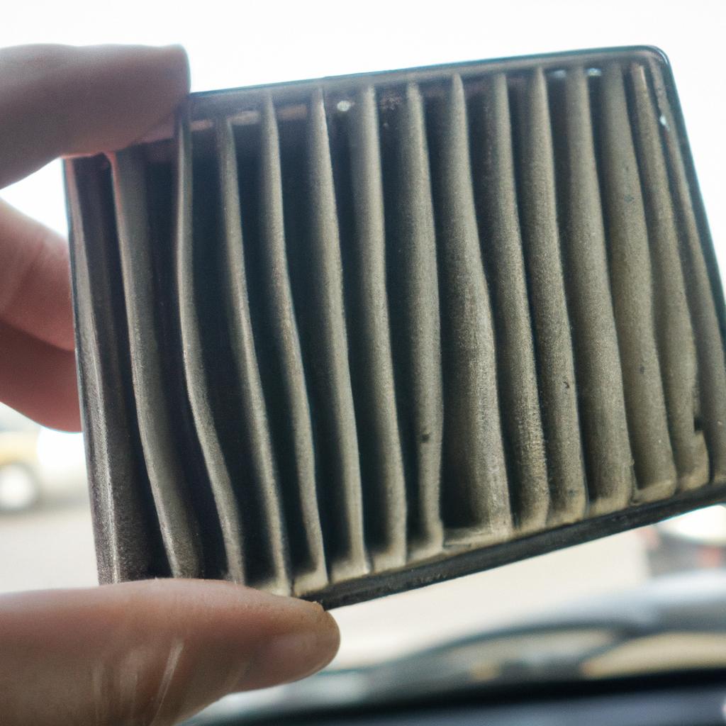 A dirty cabin air filter that needs cleaning